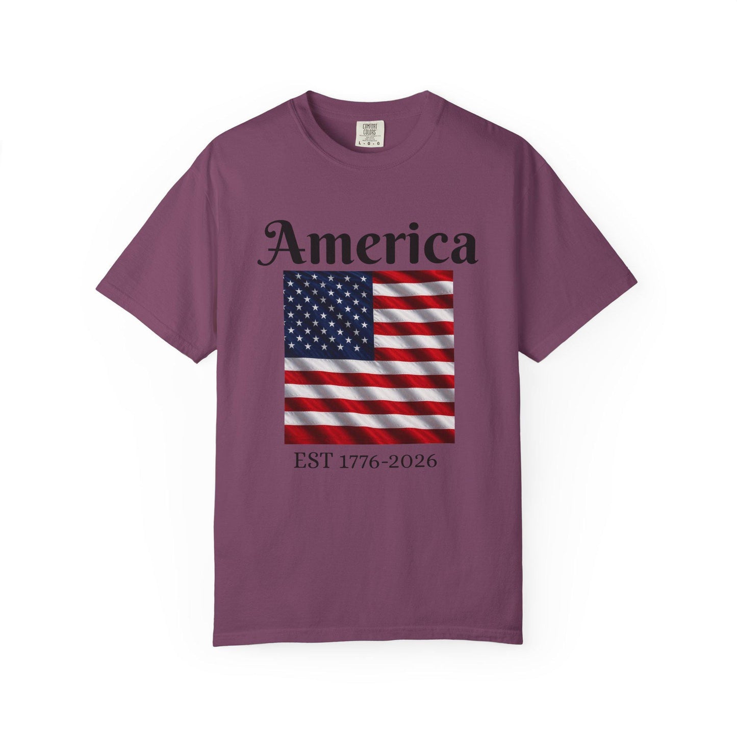 Dark plum t-shirt with America text, American flag, and EST 1776-2026
