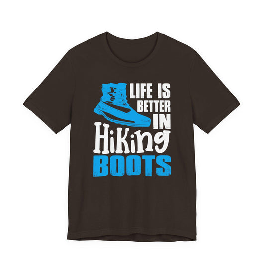 Dark brown graphic T-shirt with blue boot and text: Life is better in Hiking Boots