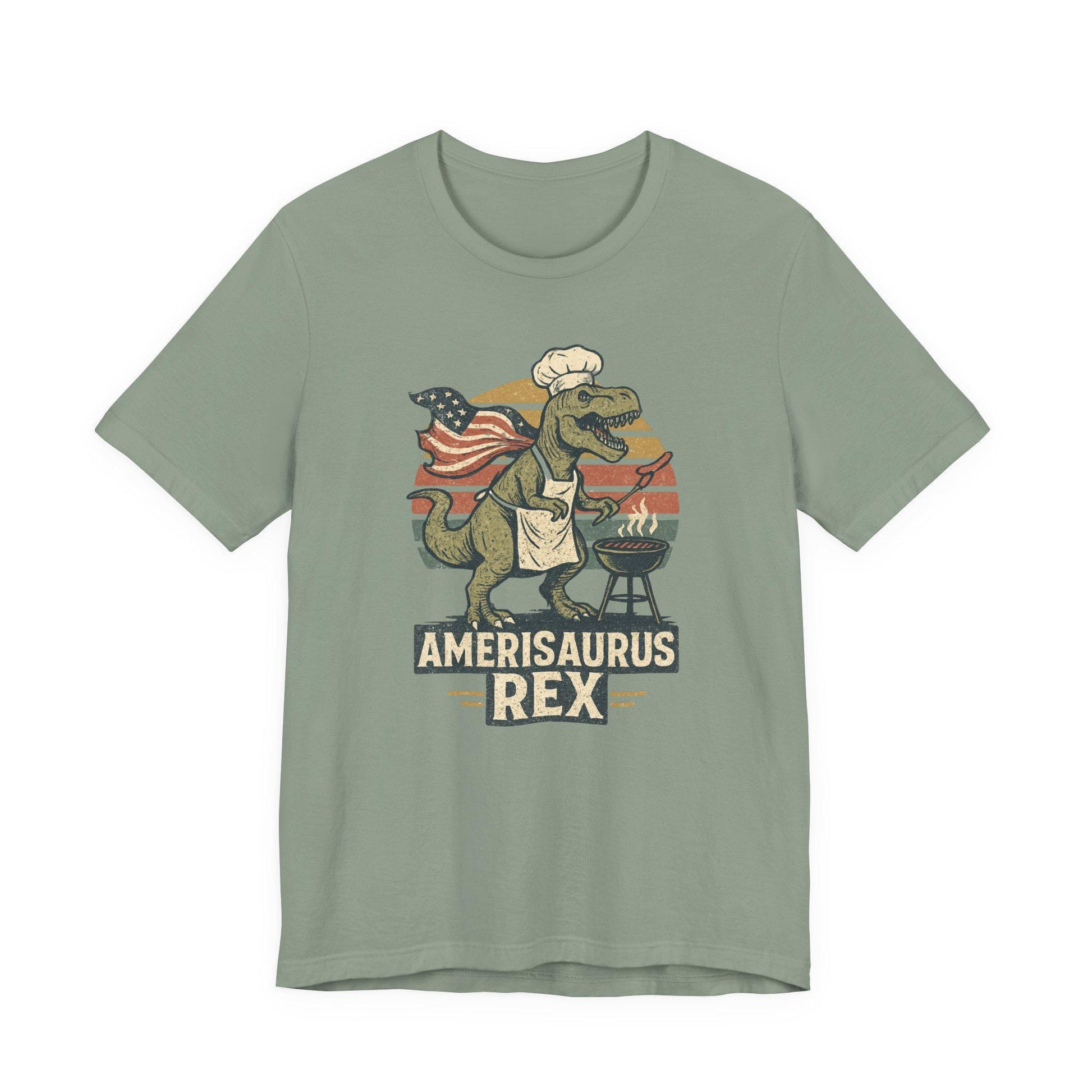 Sage green graphic dinosaur T-shirt with grill, text 'Amerisaurus Rex'.