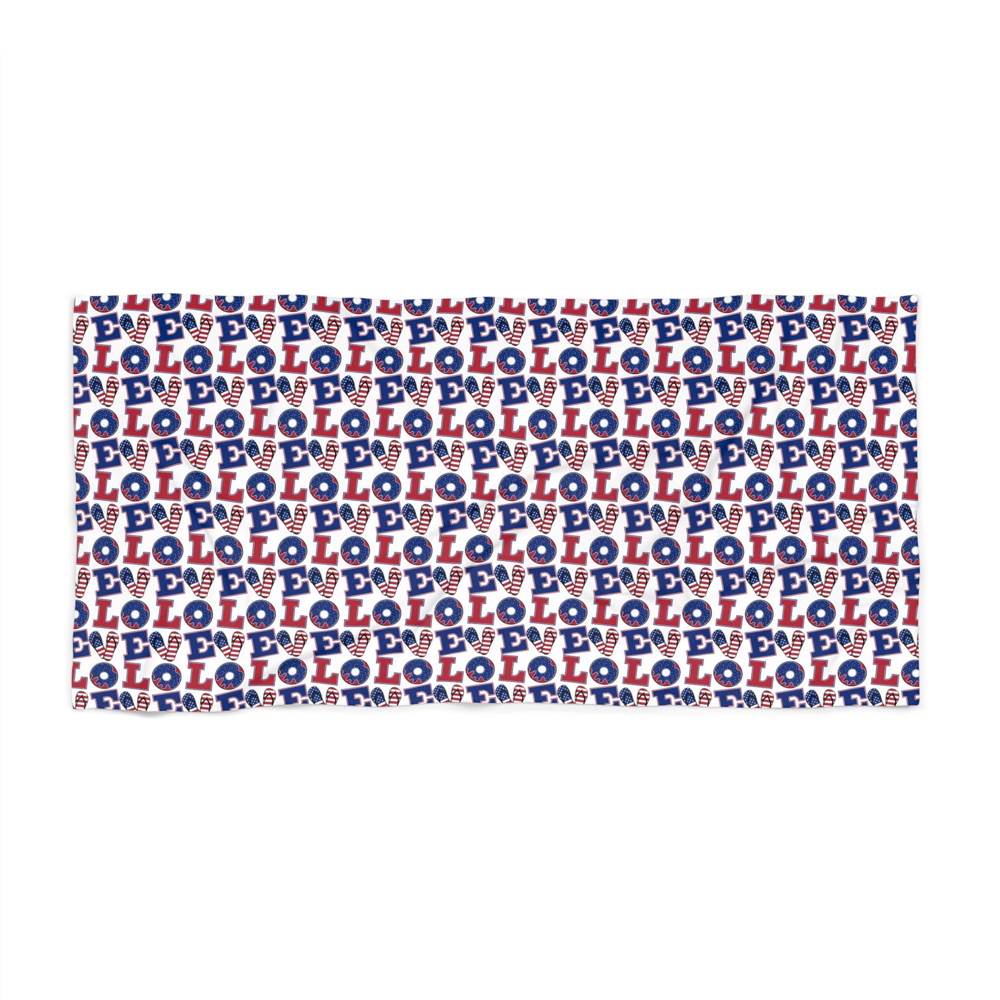 Beach towel with repeating blue and white LOL pattern, red accents, rectangular folded