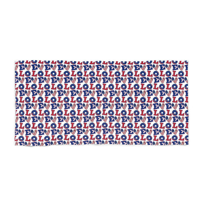 Beach towel with repeating blue and white LOL pattern, red accents, rectangular folded
