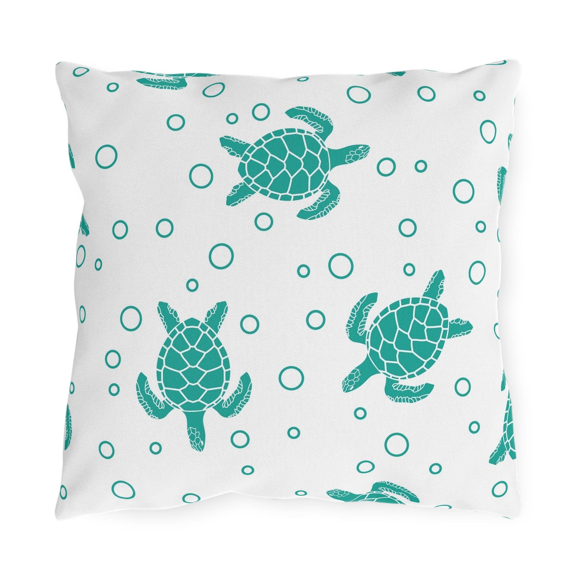 Sea turtle outdoor pillow with teal turtle and bubble dot pattern on light fabric