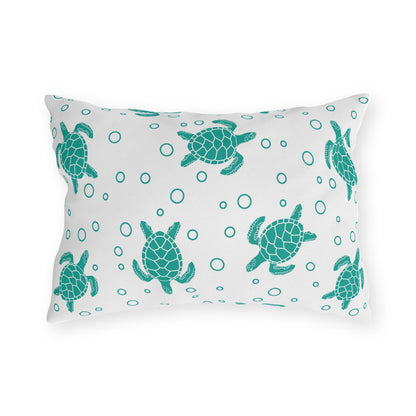Sea turtle outdoor pillow with repeating teal turtle and bubble dot pattern on light fabric