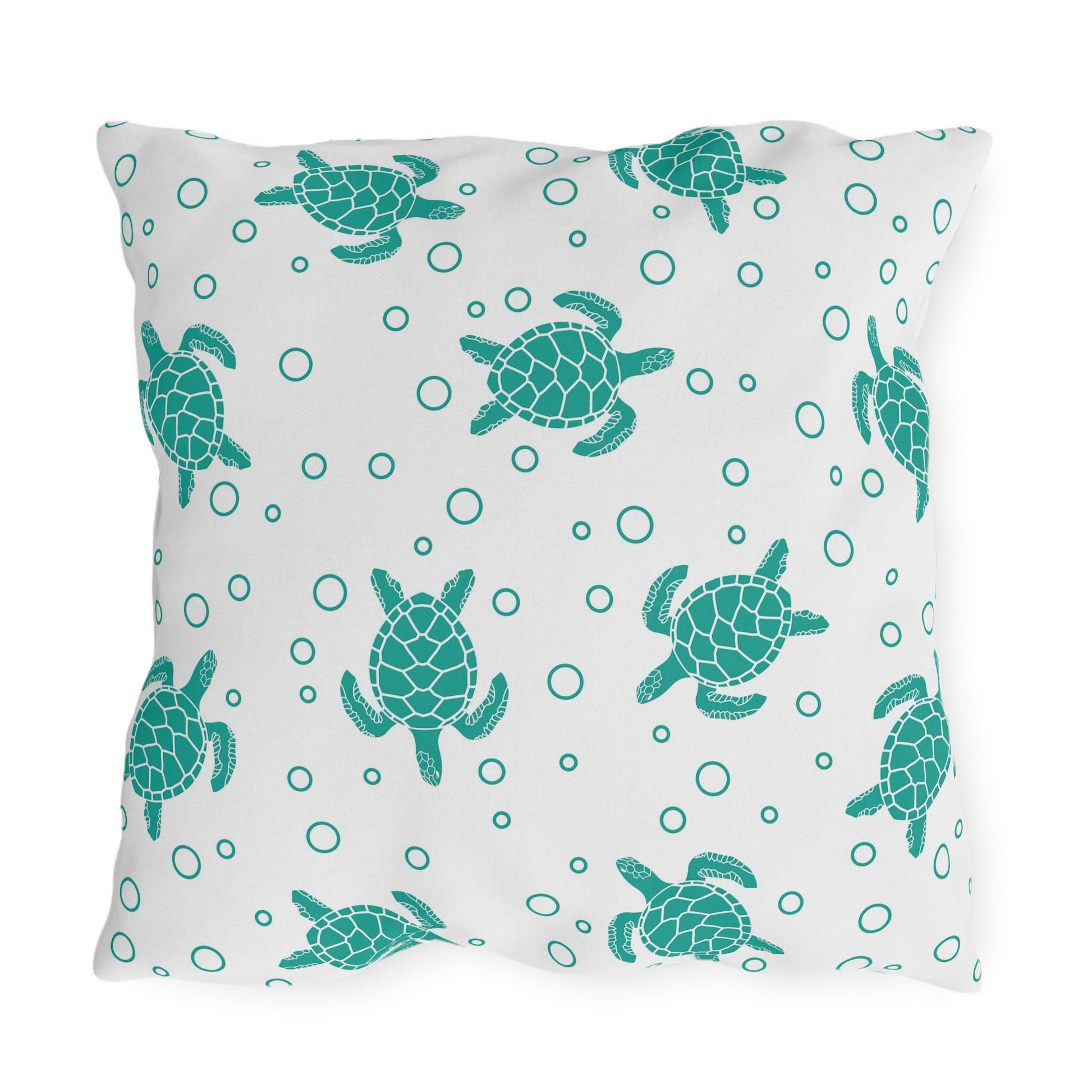 Sea turtle outdoor pillow with teal sea turtle pattern and bubble ring details on light fabric