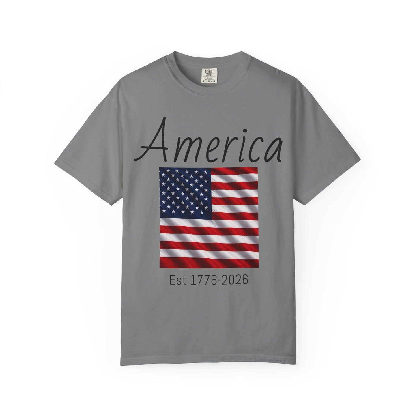 Gray T-shirt with 'America' script, U.S. flag graphic, and 'Est 1776-2026'
