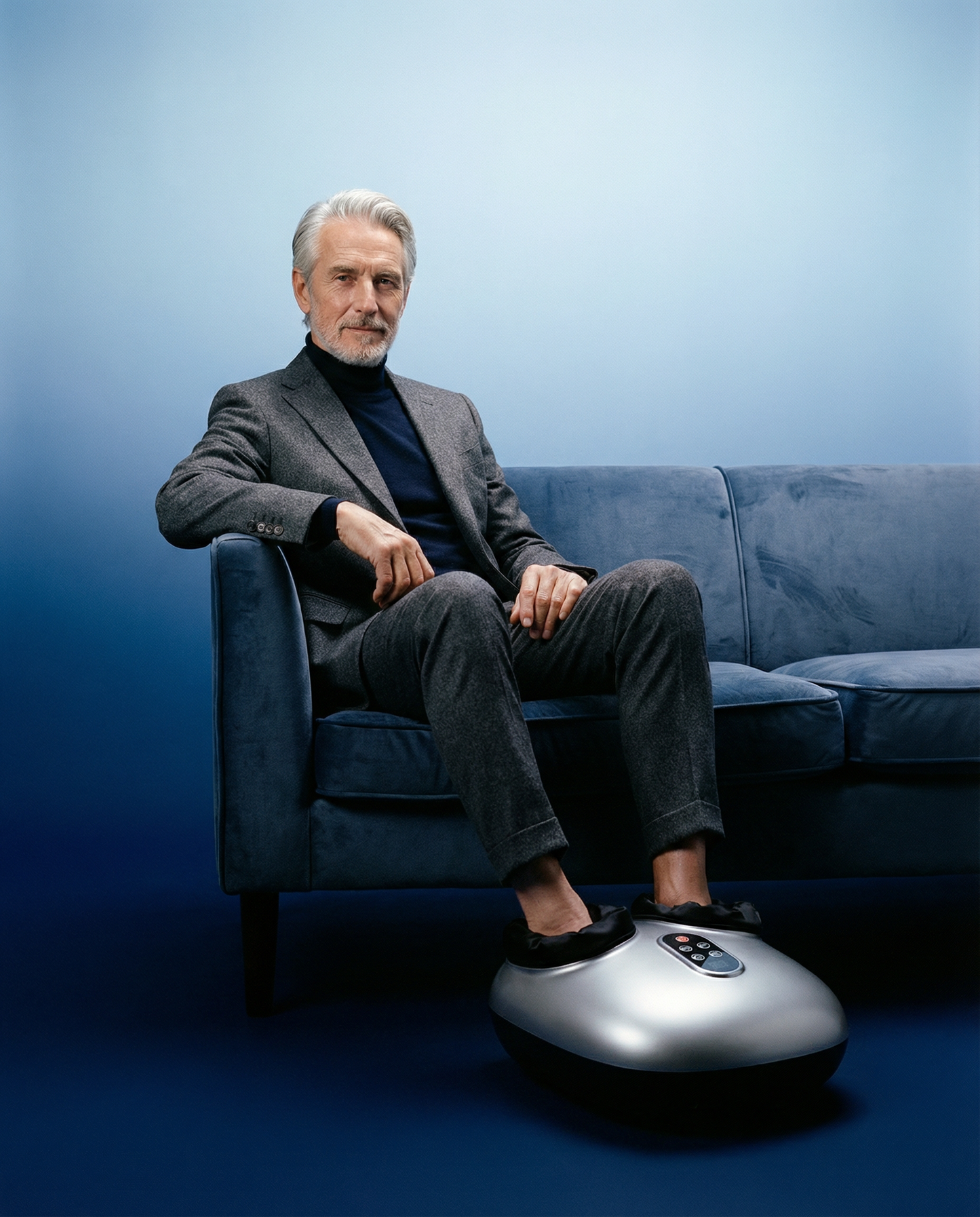 Black foot massager device with cushioned toe wells and front control panel
