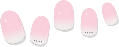 Five pink gradient gel nail wraps with rounded tips and small dot embellishments