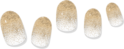 Gold-dusted gel nail wraps with glitter gradient tips on white base, five nails