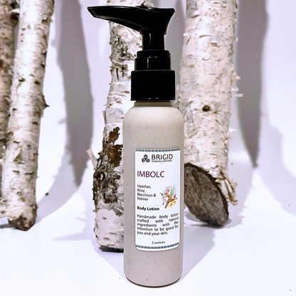 Natural body lotion bottle with black pump, speckled light beige bottle and label