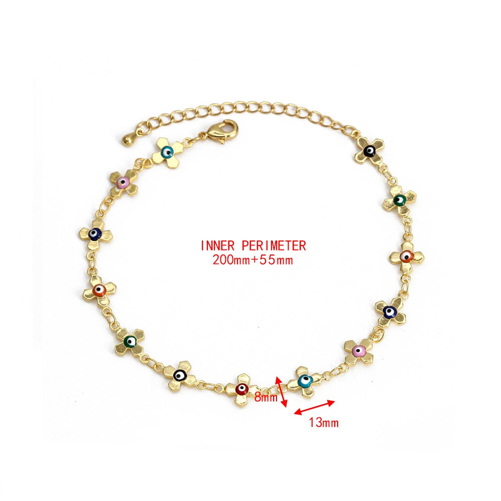 Gold-tone evil-eye charm bracelet with multicolor tiny charms and bead details