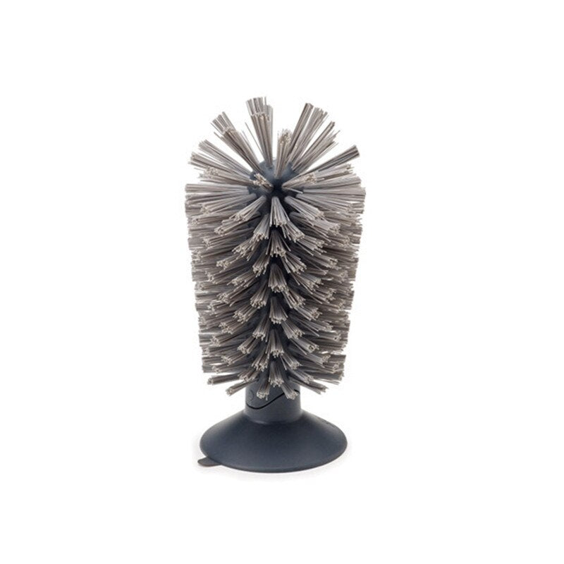 Gray standing bottle brush with dense gray bristles on dark base