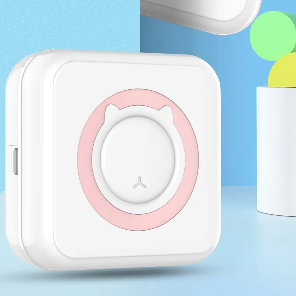 Portable thermal sticker mini printer with pink accent ring on white body