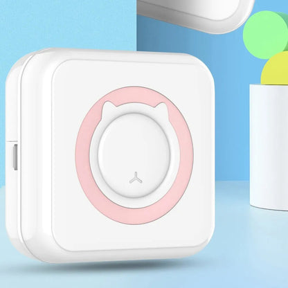 Portable thermal sticker mini printer with pink accent ring on white body