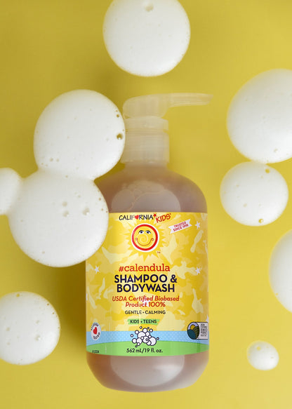 Kids Calendula shampoo & bodywash bottle with foam bubbles, yellow label