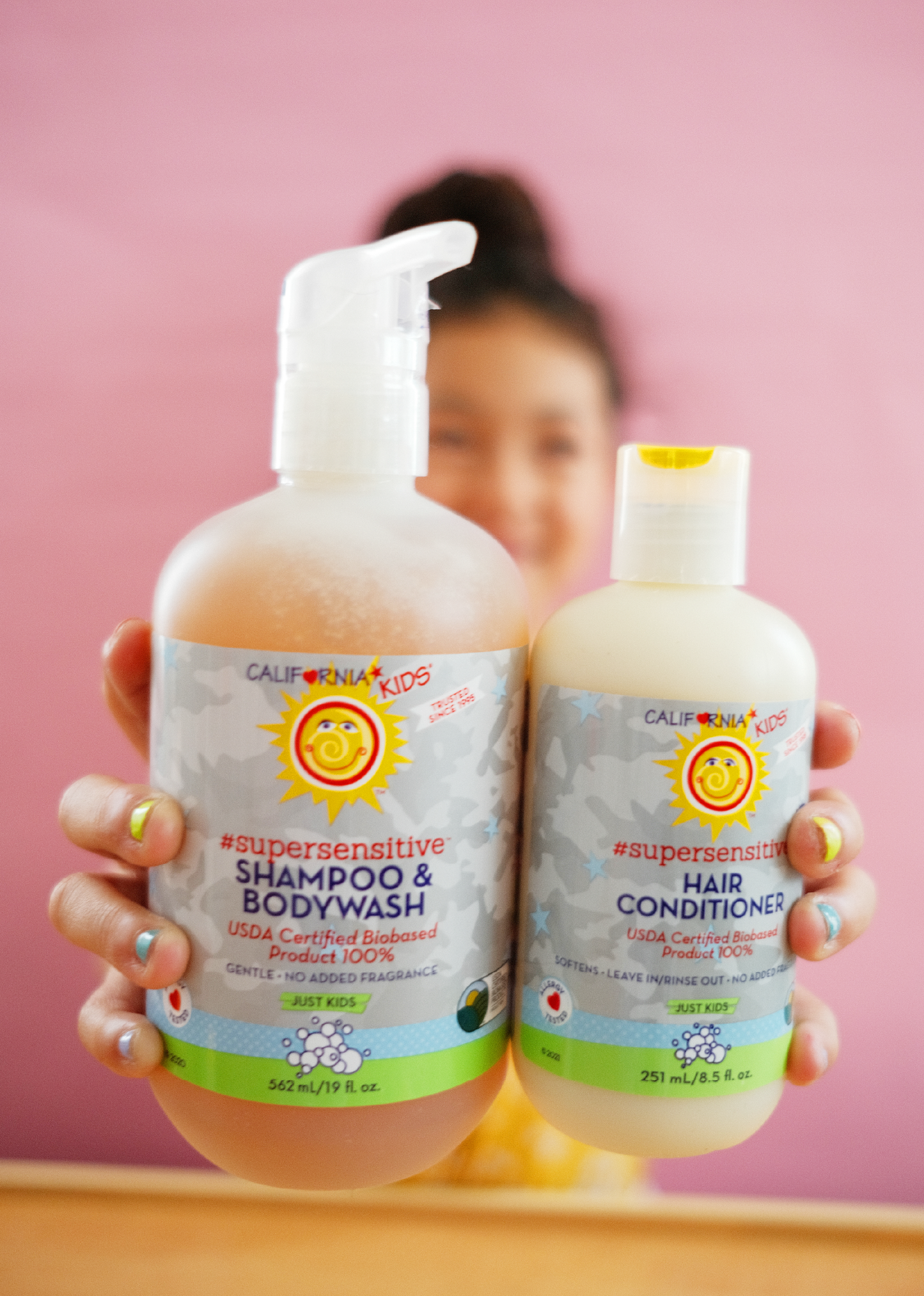 Kids supersensitive shampoo and conditioner bottles, with pump and white caps