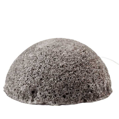 Konjac facial sponge, dark gray porous half-sphere.