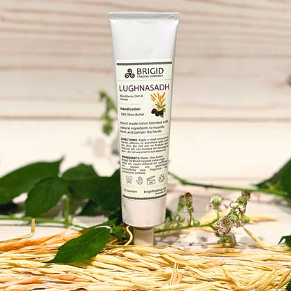 Natural hand lotion tube with LUGHNASADH label and white flip-top cap
