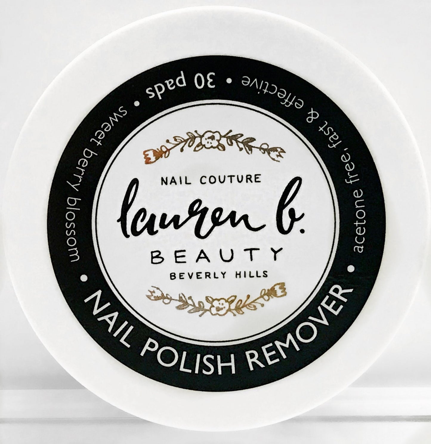 Lauren b. nail polish remover pads container with black circular label