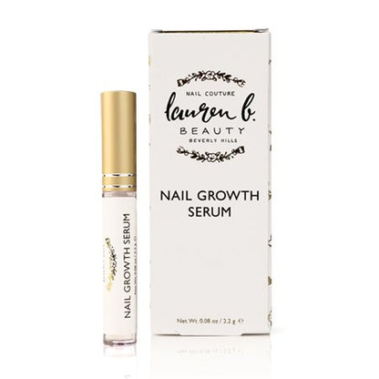 Nail growth serum bottle with gold cap beside box