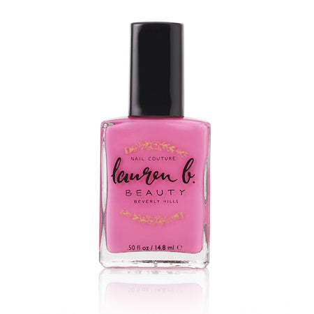 Pink vegan nail polish bottle with black cap, 0.5 fl oz glass.