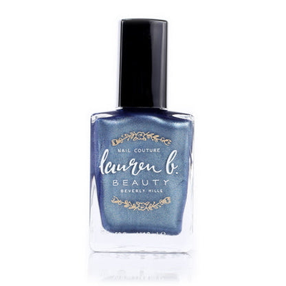 Blue glitter vegan nail polish bottle with black cap