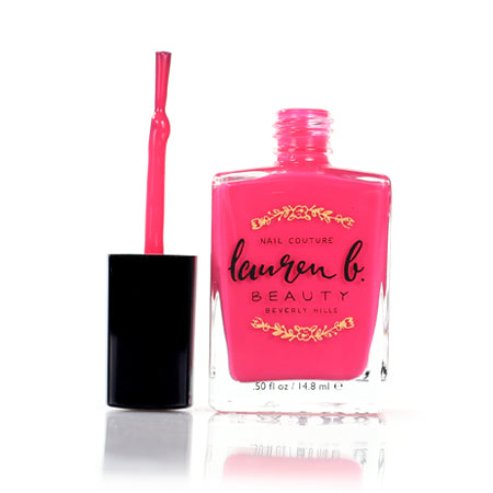 Vegan nail polish bottle with opened brush, bright pink polish