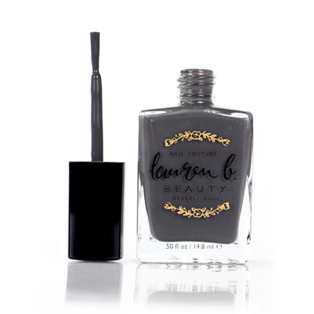 Nail polish bottle and brush applicator, glossy dark formula with gold label