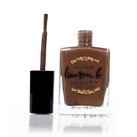 Nude No. 5 nail polish bottle with brush and black cap