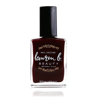 Burgundy nail polish bottle with black cap and Lauren b. Beauty label