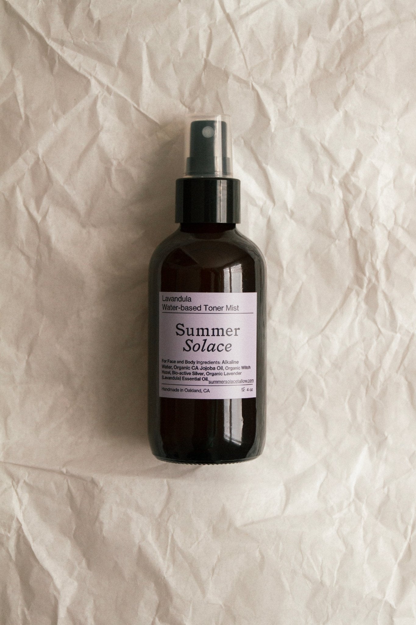 Facial toner mist spray bottle with label, amber glass and black sprayer