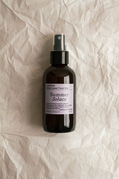 Facial toner mist spray bottle with label, amber glass and black sprayer