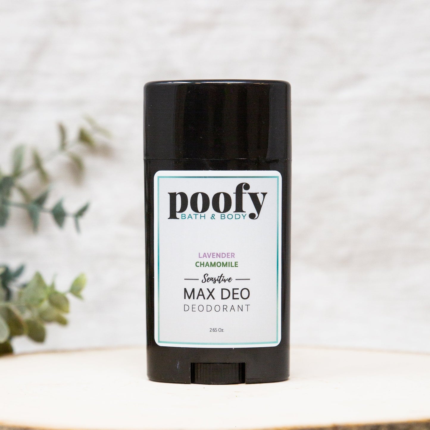 Deodorant stick with black base and Poofly lavender chamomile label