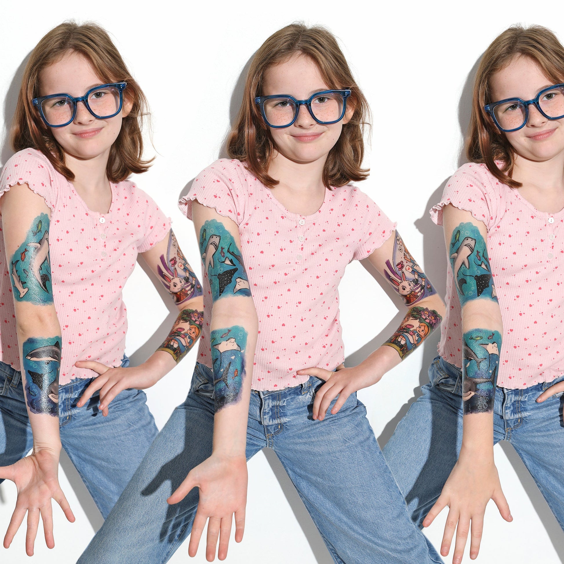 Temporary shark tattoo sleeves on a child’s arms with blue sea-creature graphics