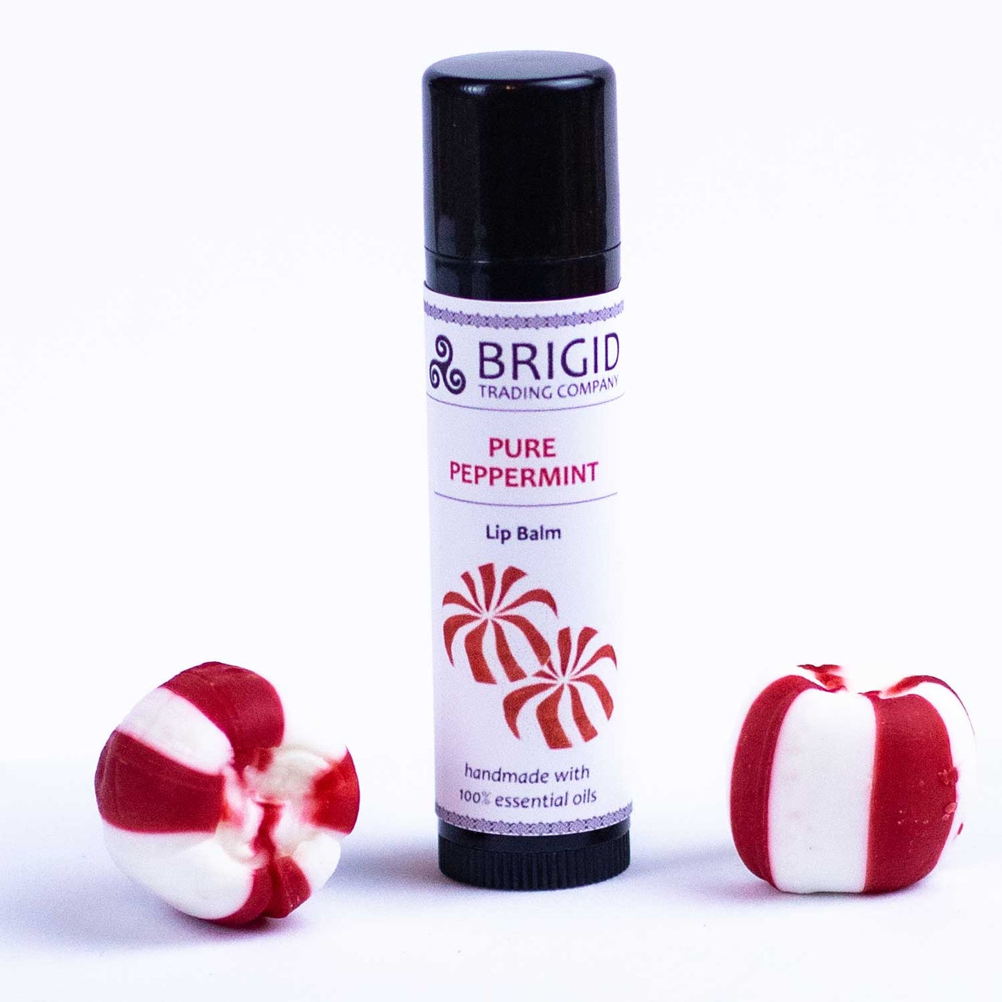 Peppermint lip balm tube, BRIGID label, black cap, with red-and-white peppermint candies