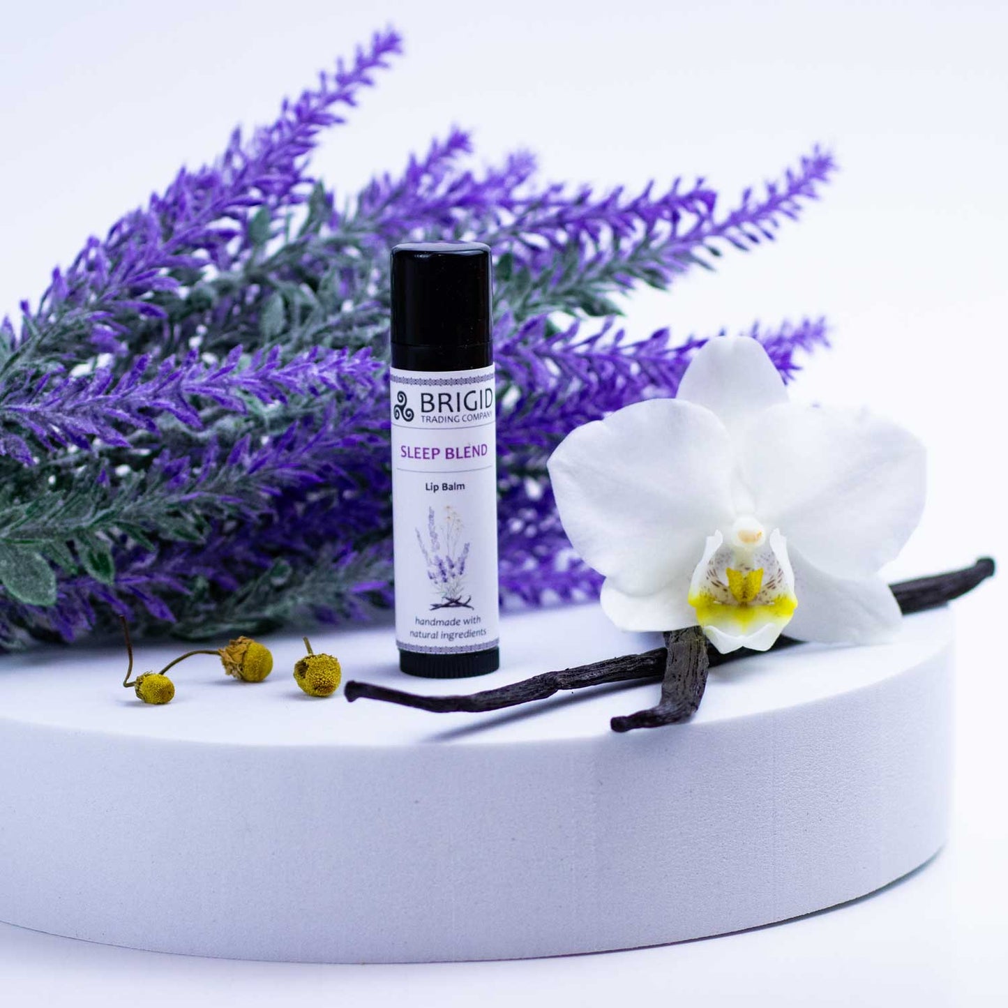 Sleep Blend lip balm tube with black cap and BRIGID label