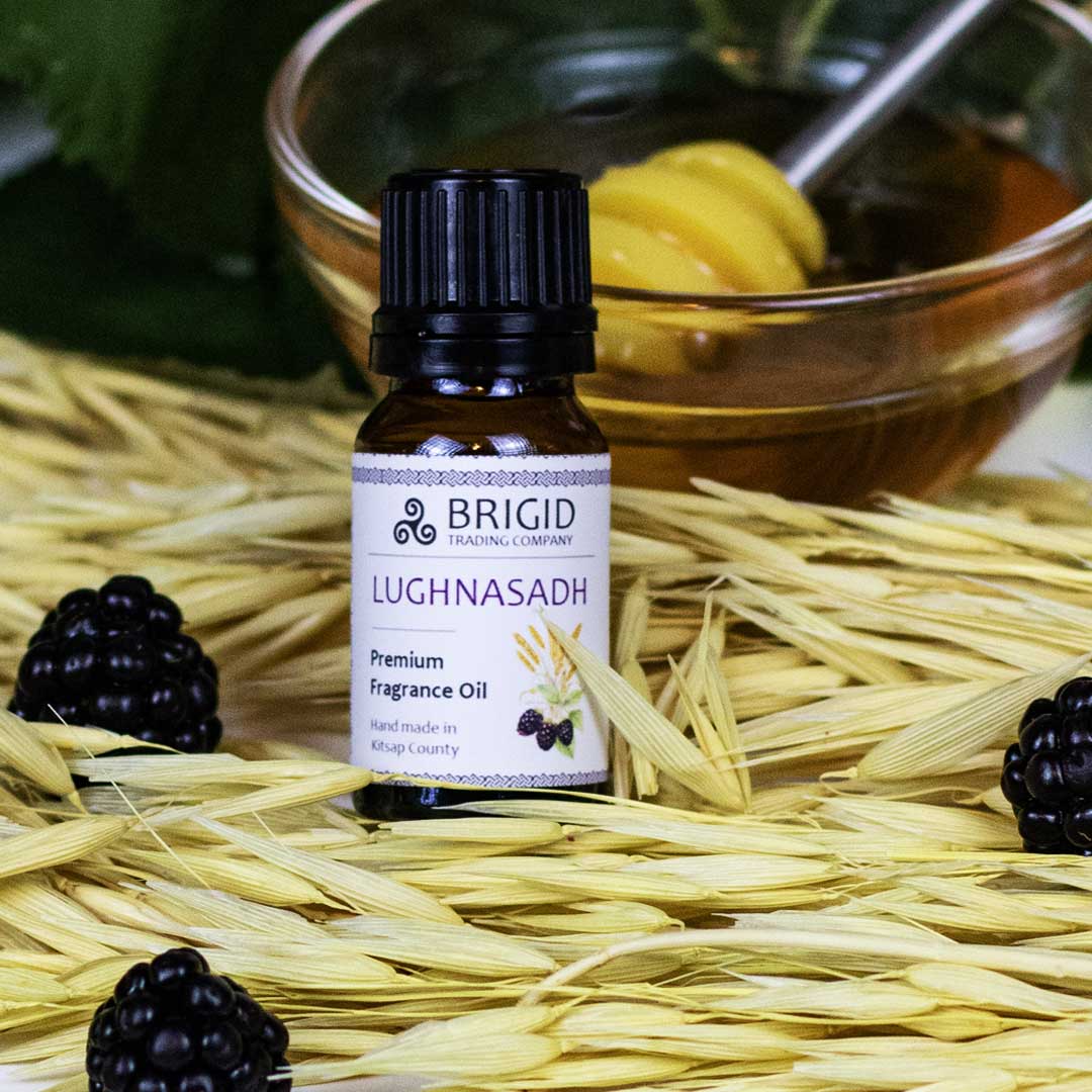 Diffuser fragrance oil bottle with black cap, label reading LUGHNASADH