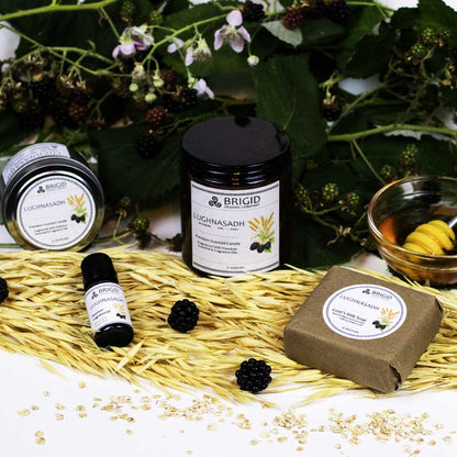 Natural fragrance roller in glass with circular tin lid and label, on straw