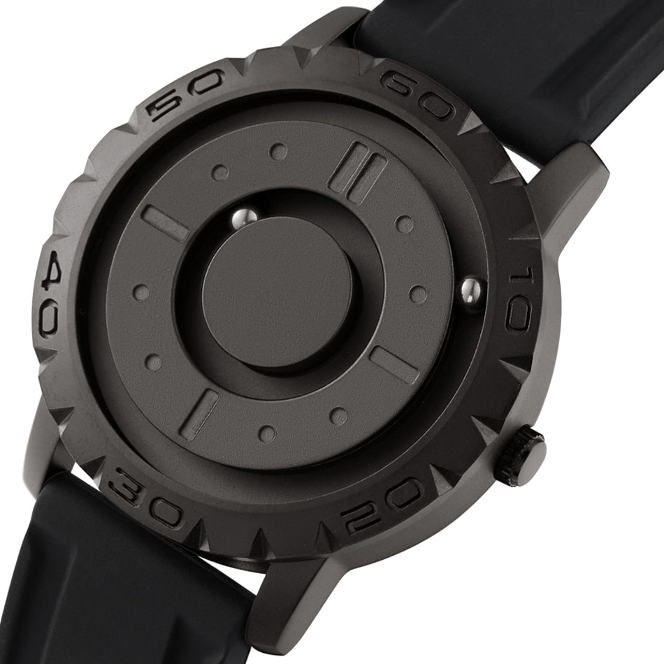 Men’s magnetic pointer watch with dark face and black bezel, showing central dial detail
