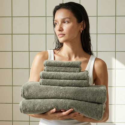 Charcoal gray cotton bath towels, stacked and folded
