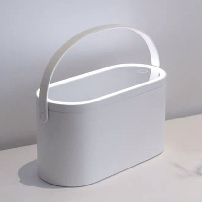 White makeup organizer box with curved handle and minimal design, covered top
