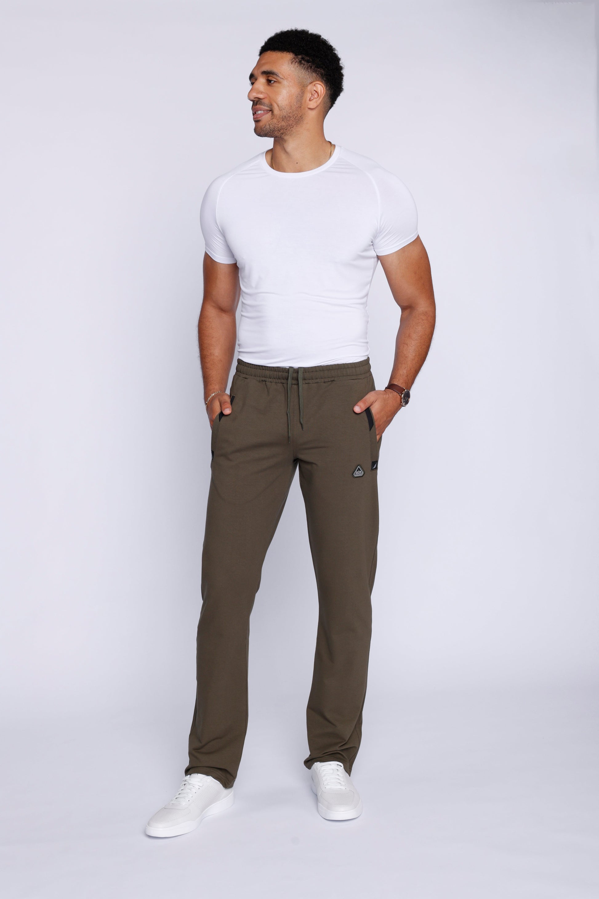 Khaki green straight athletic sweatpants with drawstring waist and side logo patch