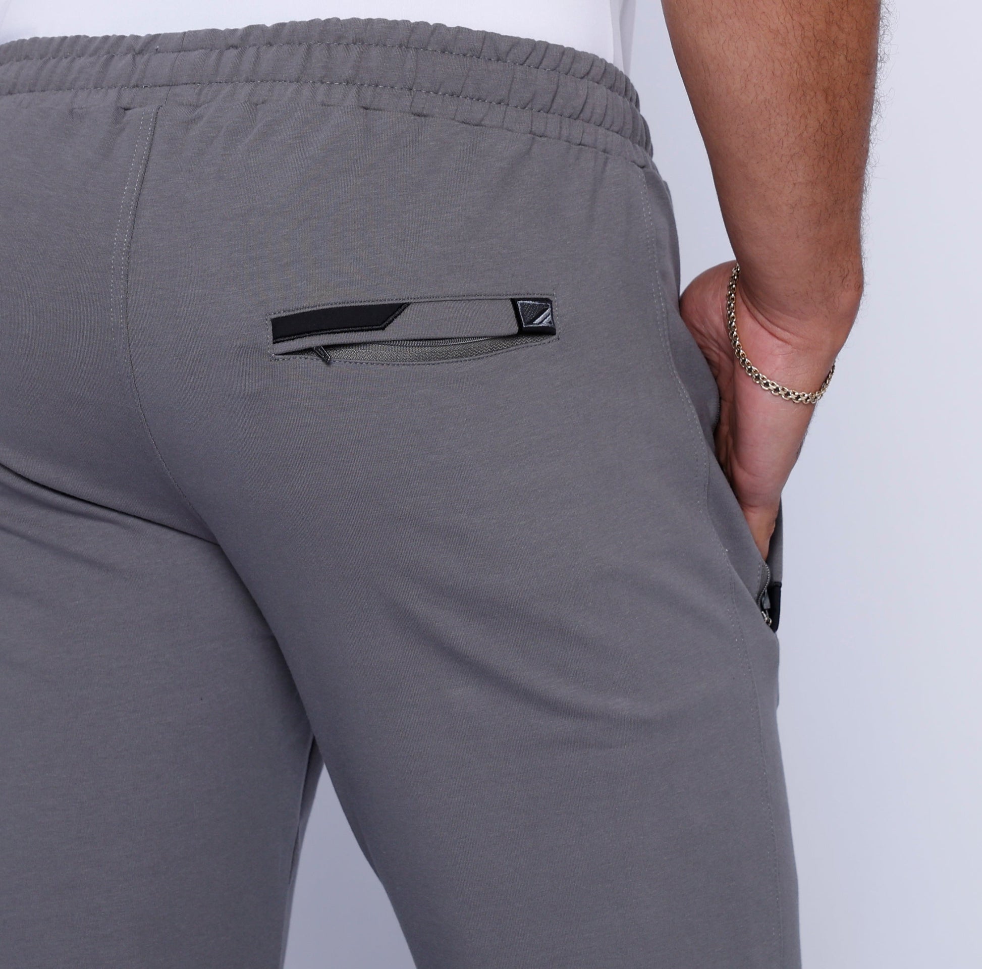 Men's athletic sweatpants, grey back with logo patch and stitched seam details