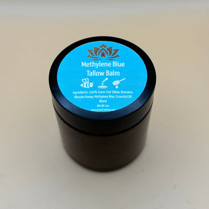 Methylene Blue tallow balm jar with blue top label and black container