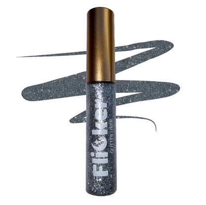 Glitter eyeliner in a metallic tube with gold cap and dark glitter wand applicator