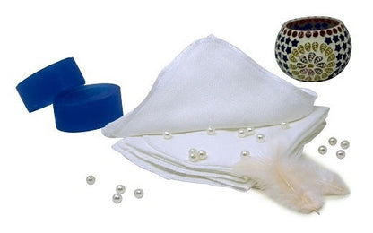 Muslin face cloth, white folded stack with small pile
