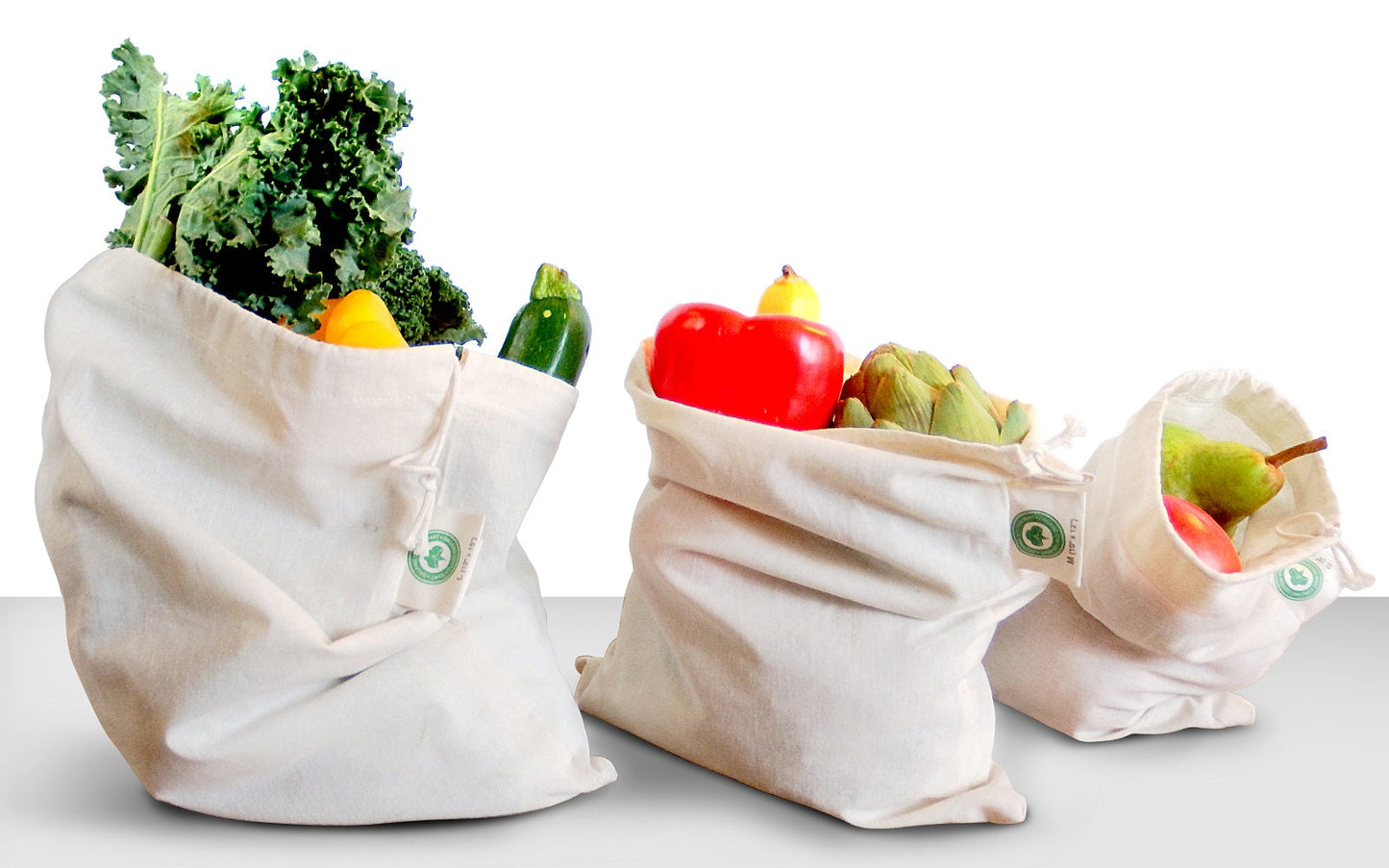 Muslin produce bags set with kale, apples, and peppers