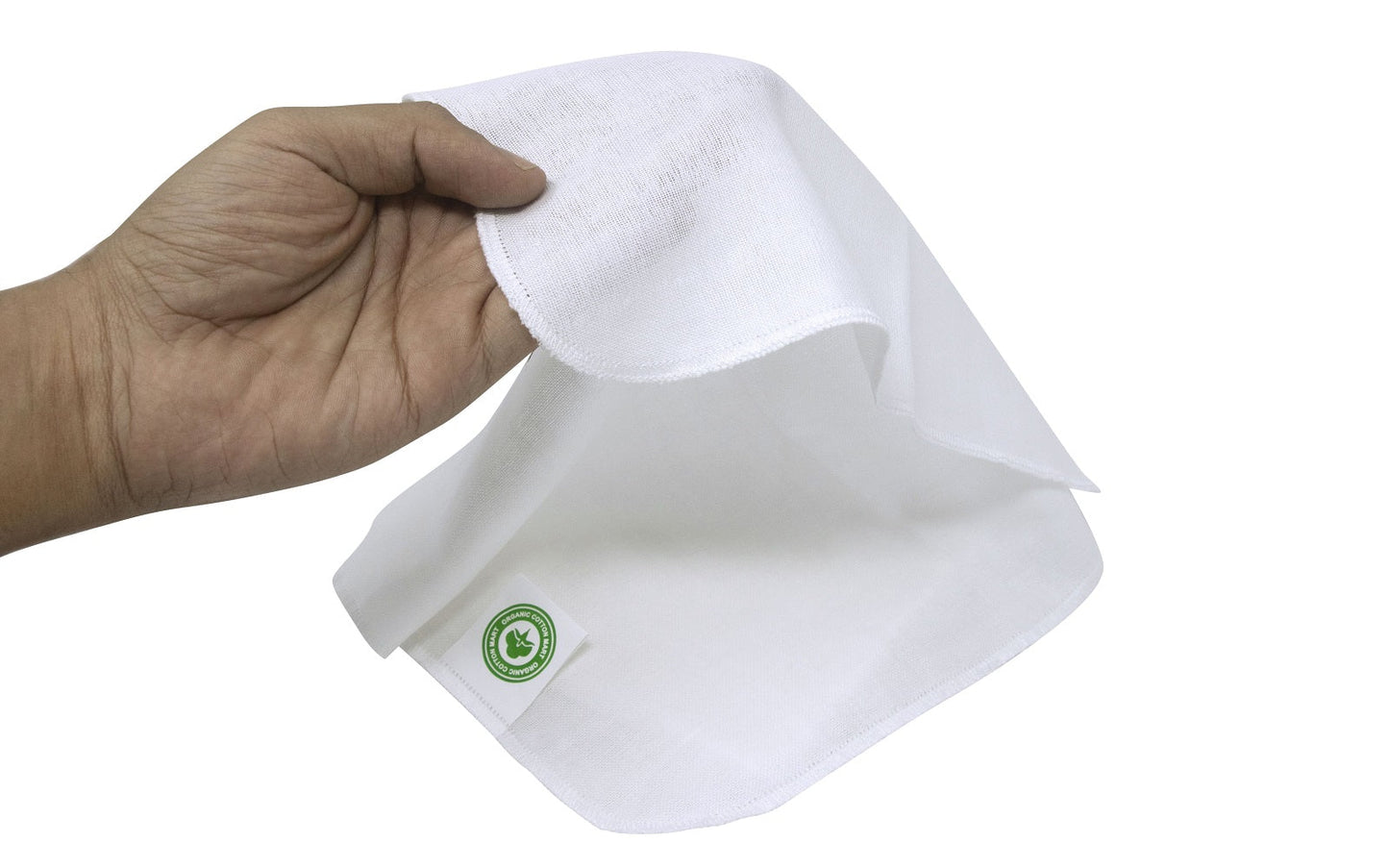 Muslin face cloth, white folded towel held by hand