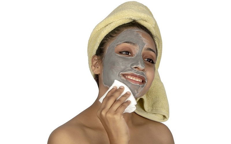Muslin face cloth on face, white cloth covering cheek and chin