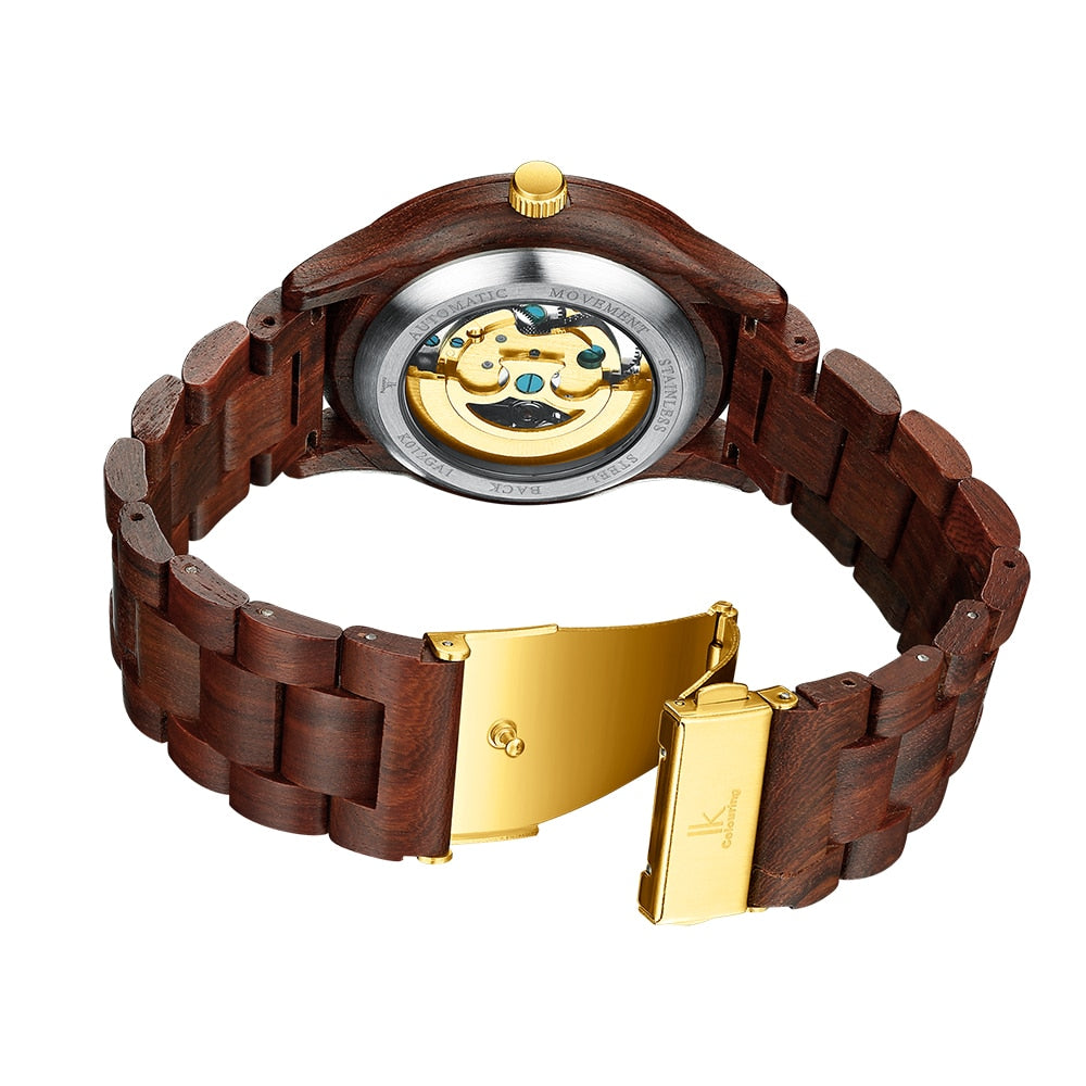 Men’s mechanical wooden watch showing open back with gold clasp and dial plate