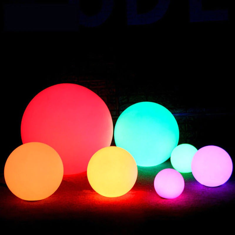 Outdoor LED garden ball lights with red, orange, yellow, green, and purple glowing spheres